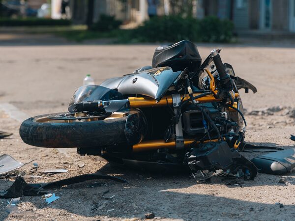 Motorcycle in an accident laying on the ground