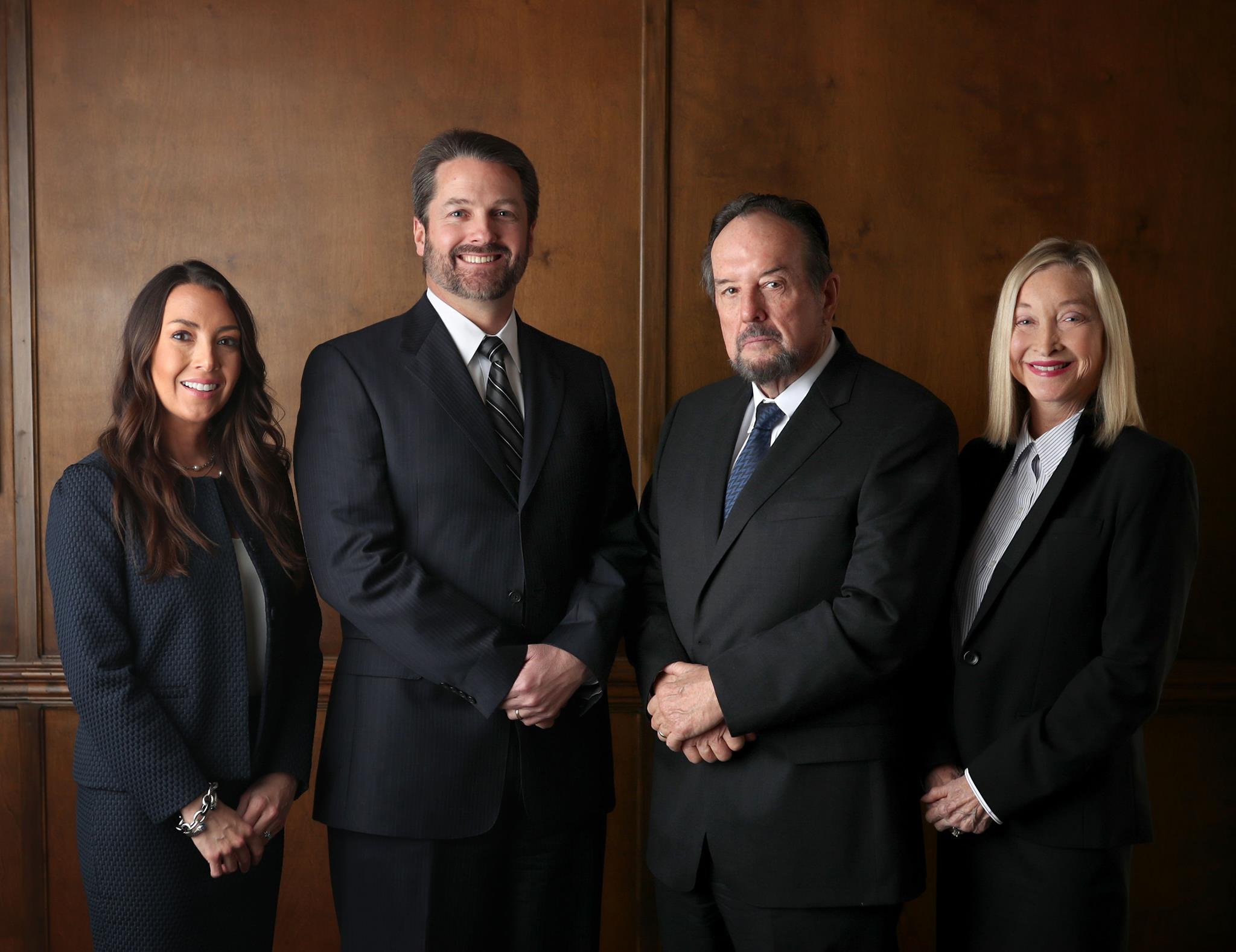 Powell, Powell & Powell attorneys standing side by side